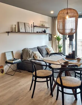 a living room with a couch and a television at AGAFAY - Two bedroom apartment in Sagrada Familia in Barcelona