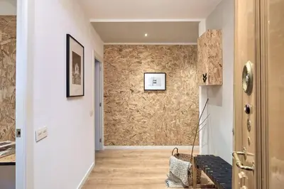 a hallway with a wooden floor and a wall at YANGRA - Two Bedroom Apartment in Consell de Cent in Barcelona