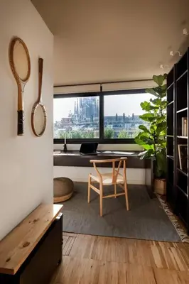a bedroom with a bed with pictures on the wall at DOURO - Penthouse with a view of the Sagrada F. in Barcelona