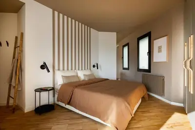 a kitchen with a large window and a living room at DOURO - Penthouse with a view of the Sagrada F. in Barcelona