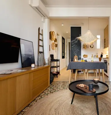 a living room with a blue couch and a table at ROVIRA - One bedroom apartment in Penedes in Barcelona