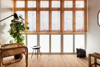 a mirror on a wall next to a table with a laptop at TEFE - Two Bedrooms apartment in Gracia in Barcelona