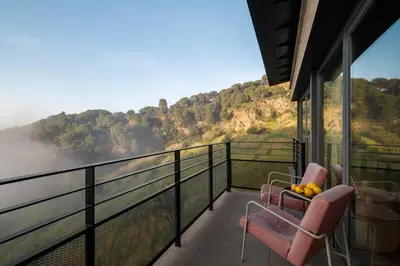 a balcony with chairs and a view of the mountains at 4 BR vila 25 minutes to Barcelona Fantastic sea views pool in Alella