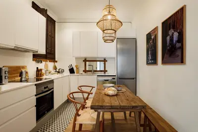 a bedroom with orange walls and a bed and a window at HIDALGO - Two bedroom apartment in Eixample in Barcelona