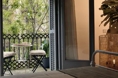 a living room with a couch and a table at ERAWAN - One bedroom apartment in Eixample in Barcelona