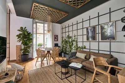 a room with a balcony with a table and chairs at ERAWAN - One bedroom apartment in Eixample in Barcelona
