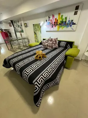 a large bed with a teddy bear on top of it at BADAROSA House Badalona next to Barcelona & beach in Badalona