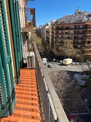 a balcony of a building with a view of a street at 2 BDR EIXAMPLE APARTMENT in Barcelona