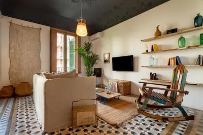 a bedroom with a bed with a book on it at LEGE - Two bedroom apartment in Mallorca St in Barcelona