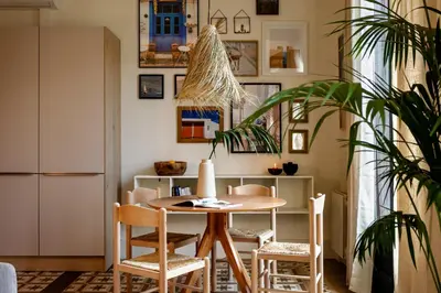 a bedroom with a large bed and two windows at MILOS - Two bedroom apartment in Mallorca St in Barcelona