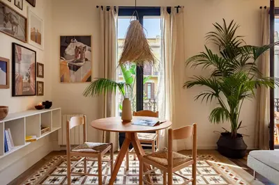 a kitchen and dining room with a table and chairs at MILOS - Two bedroom apartment in Mallorca St in Barcelona