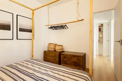 a living room with a television on a table at LEBLON - Two Bedroom Apartment in Eixample in Barcelona