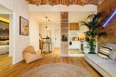 a living room with a couch and a table at LEBLON - Two Bedroom Apartment in Eixample in Barcelona
