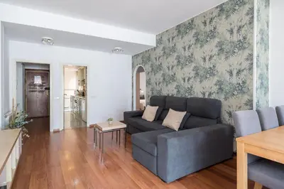 a living room with a couch and a table at Apartment with terrace a step away from Montjuic, Barcelona in Barcelona