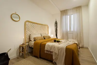 a living room with a couch and a table at TAMAN - Three Bedroom Apartment in Casanova Street in Barcelona