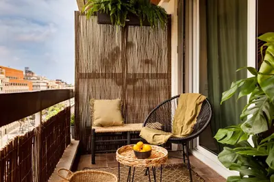 a bathroom with a toilet and a sink and a tub at TAMAN - Three Bedroom Apartment in Casanova Street in Barcelona