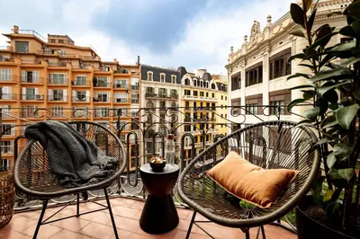 a window with a plant on a balcony at NANAY - Two bedroom apartment in Gracia in Barcelona