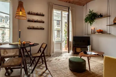 a hallway with a mirror and a table with chairs at NANAY - Two bedroom apartment in Gracia in Barcelona