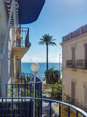 a view of the ocean from the balcony of a cruise ship at Ferdinand Apartment by Hello Homes Sitges in Sitges