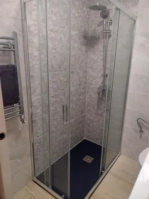 a shower with a glass door in a bathroom at Mar & Cunit in Cunit