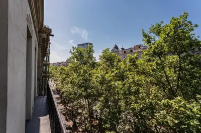 a view of trees from a balcony of a building at Sweett - Casa Palau in Barcelona