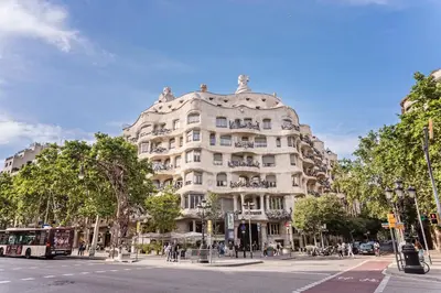 a large white building on a city street at Sweett - Jardinets in Barcelona