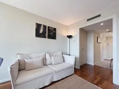 a living room with a white couch in a room at Stay U-nique Apartments Sants II in Barcelona
