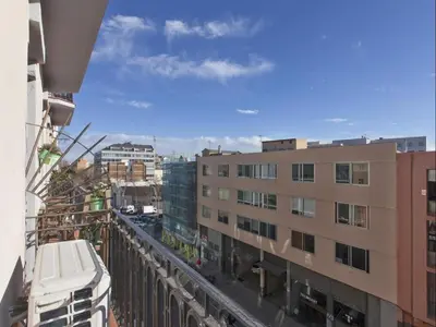 a view from the balcony of a building at Sunny Playa Apartment in Barcelona