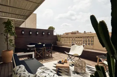 a living room with a couch and a table and a mirror at TAKLA - Two bedroom apartment in Diputación St in Barcelona