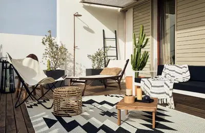 a balcony with chairs and tables on a building at TAKLA - Two bedroom apartment in Diputación St in Barcelona