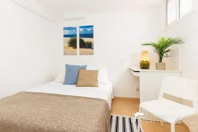 a dining room and living room with a table and chairs at Charming Spanish Villa private pool / Sea views in Sitges