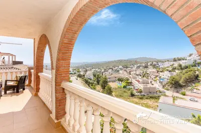 a balcony with a view of a city at Charming Spanish Villa private pool / Sea views in Sitges
