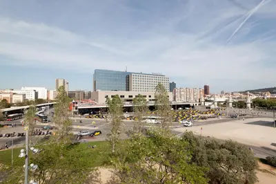 a city with a lot of traffic in a parking lot at Penthouse Vallespir in Barcelona