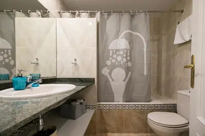 a bathroom with a sink and a shower at Be Barcelona Eixample Urquinaona II in Barcelona