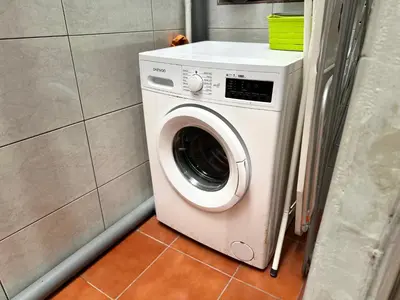a washer and dryer in a small room at Nice apartment close PARK GÜELL 2 in Barcelona