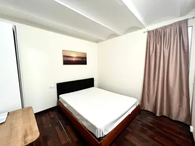 a small bedroom with a bed and a window at Nice apartment close PARK GÜELL 2 in Barcelona
