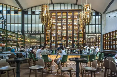 a rendering of a restaurant with people sitting at tables at Habitat apartments Barcelona Center in Barcelona