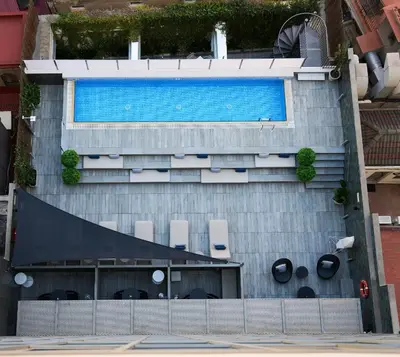 an overhead view of a building with a swimming pool at Catalonia Square 4* Sup in Barcelona