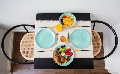 a table with two plates of food on it at Divino Hotel Boutique in Sitges