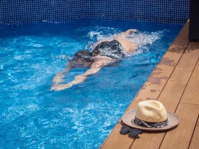 a swimming pool in front of a building at ARCELON HOTEL - From 2023 in Barcelona