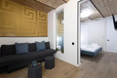 a room with two chairs and a table with two cups at The Collection Barcelona - Amazing 3 Bedroom Apartment with indoor POOL in Barcelona
