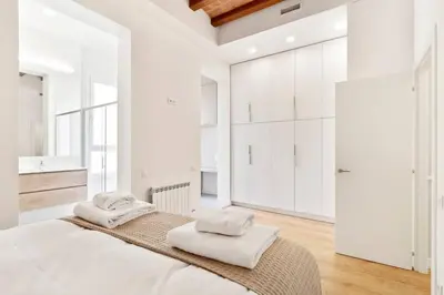 a white kitchen with a sink and a microwave at The Collection Barcelona - Arc de Triomf Luxury Modern 2-Bedroom 2-Bathroom in Barcelona