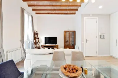 an empty street with a crosswalk in a city at The Collection Barcelona - Arc de Triomf Luxury Modern 2-Bedroom 2-Bathroom in Barcelona