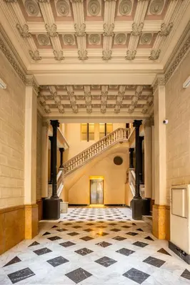 an empty hallway with a staircase in a building at The Collection Barcelona - Elegant 3-bedroom Apartment in the Heart of BCN in Barcelona