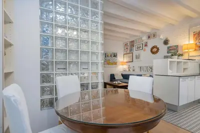 a dining room with a glass block wall at The Collection Barcelona - Exclusive 2 bedroom apartment in the city center in Barcelona