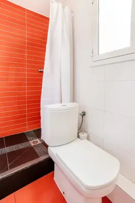 a bedroom with a dresser and a glass closet at The Collection Barcelona - Pl Universitat Bright and cozy 2BD - 2BTH in Barcelona