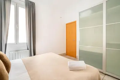 a bathroom with a shower and a toilet and a sink at The Collection Barcelona - Historic apartment with private terrace in Example in Barcelona