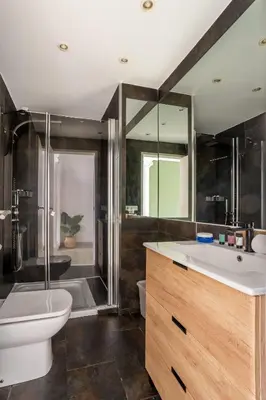 a bathroom with a sink and a toilet and a shower at The Collection Barcelona - Exclusive Luxe Design - Large Tranquil Penthouse in Barcelona