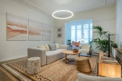 a living room with a couch and a table at The Collection Barcelona - Exclusive Paseo de Gracia 5BD 5BTH with terrace in Barcelona