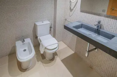 a bathroom with a toilet and a sink at The Collection Barcelona - Bright and modern Duplex with terrace in Eixample district P1 in Barcelona